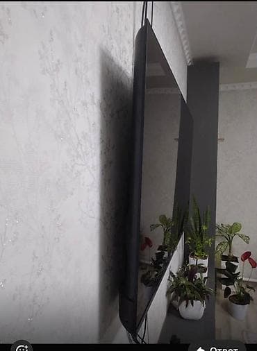 ТВ и видео: Настенный телевизор с тонкой рамкой и большим экраном (приблизительно — 1