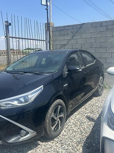coroll: Toyota Corolla: 2019 г., 1.8 л, Робот, Гибрид, Седан — 2