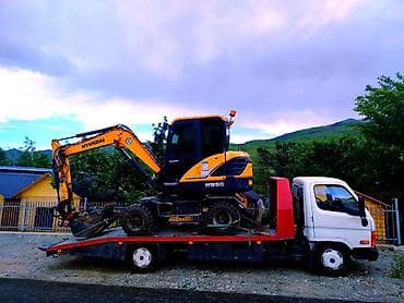 С лебедкой, С жёсткой сцепкой, С ломаной платформой