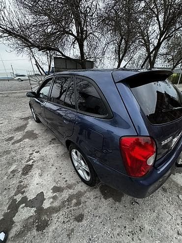 mitsubishi evolution: Mazda 323: 2002 г., 1.6 л, Ручные, Бензин, Универсал — 2