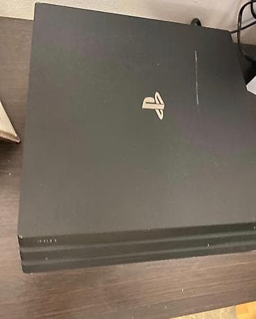 сони игры: Игровая консоль Sony PlayStation 4 Pro (черная) - Версия Pro с — 2