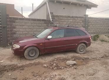 bmv e32: Mazda 323: 2001 г., 1.5 л, Универсал — 2