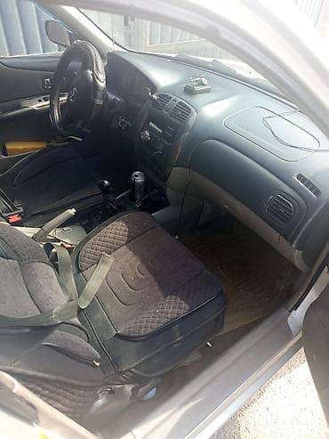 dot 4: Mazda 323: 2002 г., 1.6 л, Механика, Бензин, Универсал — 2