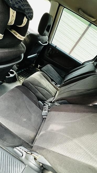 Транспорт: Mazda : 2003 г., Кол менен иштөөчү, Бензин — 3