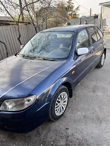 магазин мустанк: Mazda 323: 2003 г., 1.3 л, Ручные, Бензин, Хэтчбэк — 1