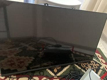 Телевизор VASIN с диагональю около 32"–40" (по габаритам корпуса)