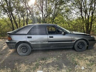 шины на гольф 2: Mazda 323: 1992 г., 1.6 л, Механика, Бензин, Хетчбек — 4