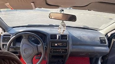 каропка автомат: Mazda 323: 1999 г., 1.5 л, Автомат, Газ, Седан — 8
