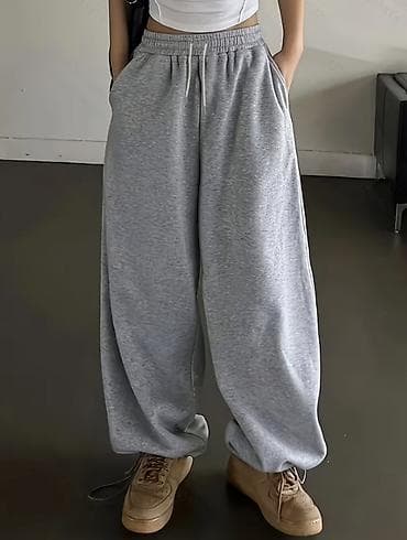 оранжевые штаны: Свободные спортивные штаны унисекс в меланжево-сером цвете. - — 1