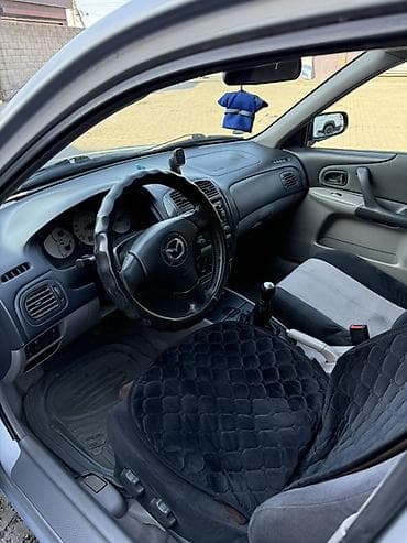 w210 e280: Mazda 323: 2003 г., 1.6 л, Механика, Бензин, Универсал — 5