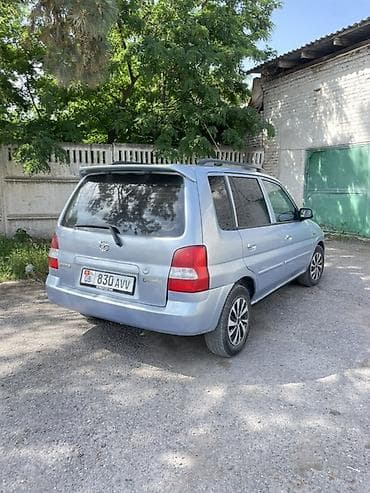 бар авто: Mazda Demio: 2001 г., 1.3 л, Кол менен иштөөчү, Бензин, Хетчбек — 7
