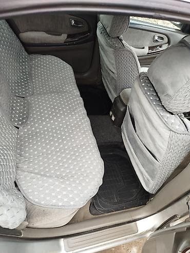 нексия рестайлинг: Седан серебристого цвета, 4 двери, просторный салон, черная тканевая — 8