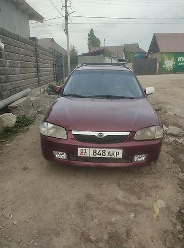 bmv e32: Mazda 323: 2001 г., 1.5 л, Универсал — 1