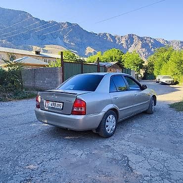 бутка бу: Mazda Familia: 2002 г., 1.6 л, Автомат, Бензин, Седан — 6