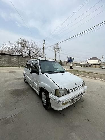 оной авто: Компактный городской хэтчбек белого цвета, 5 дверей. Практичный салон — 2