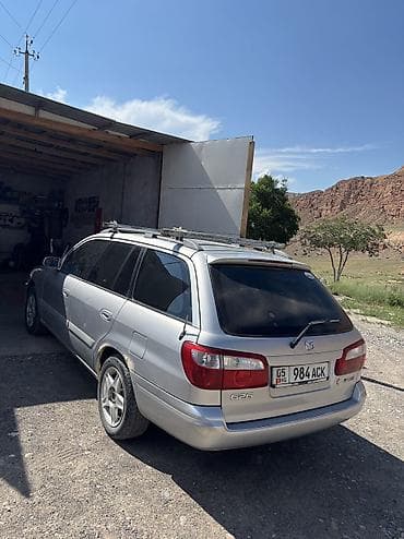 audi q4: Mazda Capella: 2001 г., 2 л, Механика, Бензин, Универсал — 4