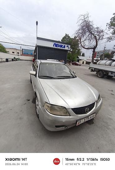 Mazda Familia: 2001 г., Универсал — 6