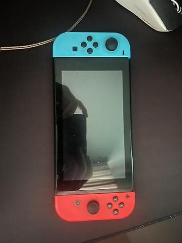 пле: Nintendo Switch с неоновыми Joy‑Con (синий/красный) - Гибридная — 1