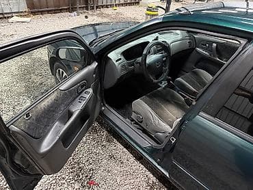 е34 люк: Mazda 323: 2000 г., 1.3 л, Механика, Бензин, Седан — 8