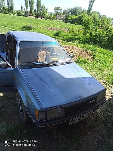 для такси авто: Mazda 323: 1985 г., 1.5 л, Механика, Бензин, Хэтчбэк — 4