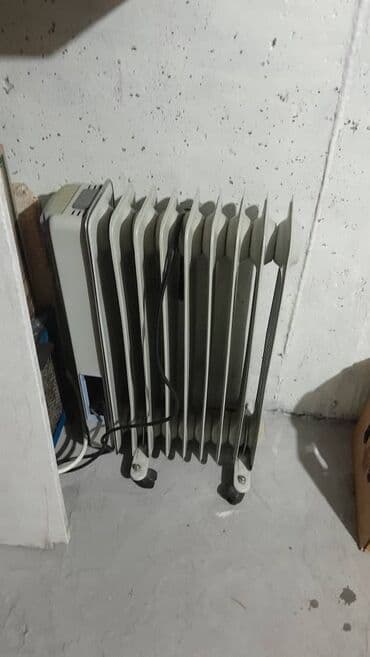 Масляный электрический радиатор-обогреватель на колесиках