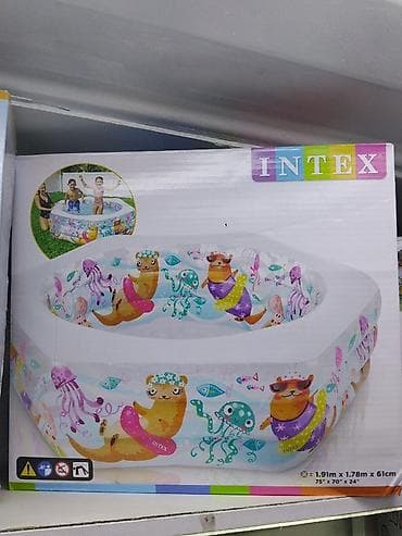 Надувной семейный бассейн Intex с ярким принтом морских животных. -