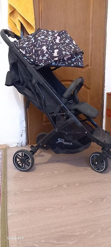 Прогулочная коляска складная (тип трость/книжка) - Легкая рама