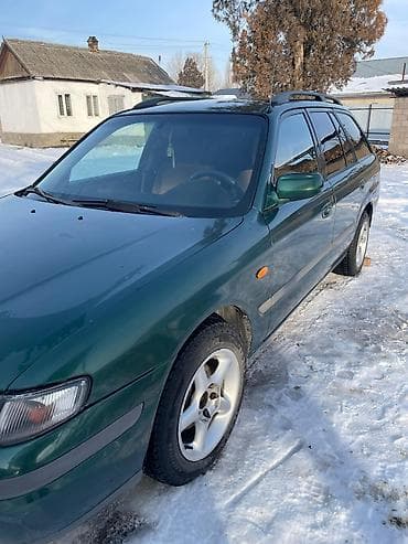 наклейки для авто: Mazda 626: 1998 г., 2 л, Механика, Универсал — 2