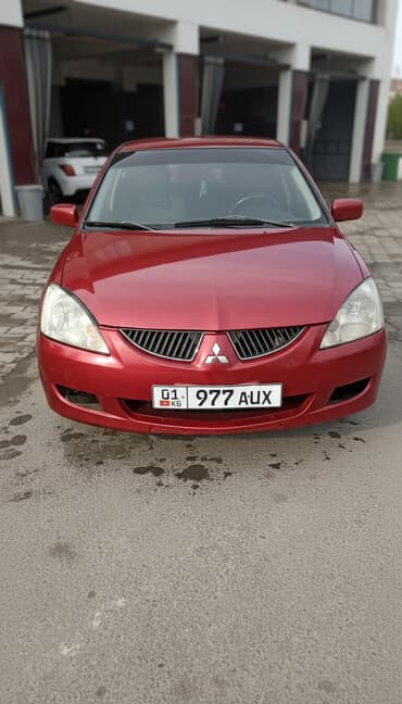 домкрать: Mitsubishi Lancer: 2004 г., 1.8 л, Механика, Бензиновая, Универсал — 1
