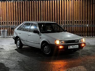 донголок 14 с: Mazda 323: 1987 г., 1.5 л, Ручные, Бензин, Хэтчбэк — 1