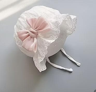 мурской шапка: Продаю НОВЫЙ чепчик с красивым розовым бантиком для девочки 5-8 — 1