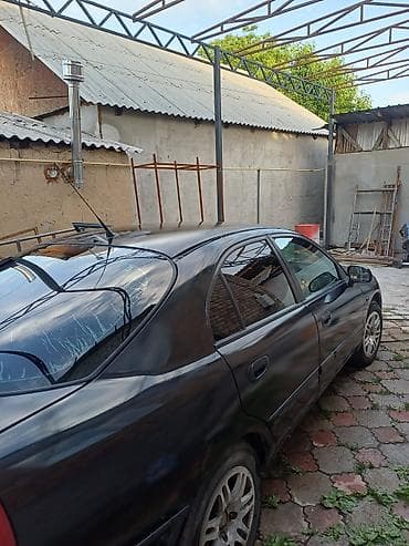 mazda cronos: Mitsubishi Carisma: 2002 г. — 4