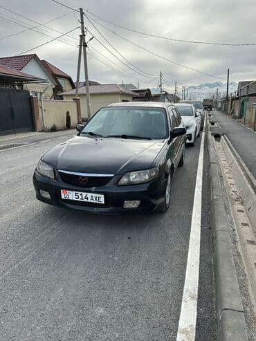 Транспорт: Mazda Familia: 2002 г., 1.6 л, Механика, Бензин, Универсал — 8