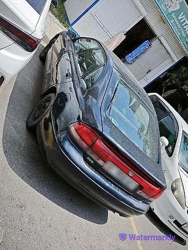 Транспорт: Mazda 626: 1996 г., 2 л, Механика, Бензин, Хэтчбэк — 4