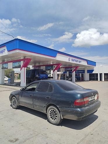 авто салона: Toyota Carina E: 1994 г., 1.6 л, Механика, Бензин, Седан — 4