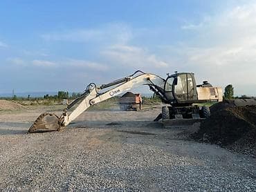 штанговый мотор или цепной: Экскаватор, 2003 г., Колесный — 1