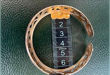 honor bend: Серебряный браслет с позолотой с ажурным орнаментом. В центре браслета — 8