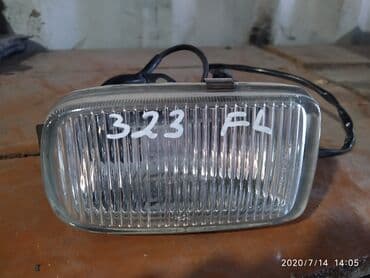 туманка на степ: Левая противотуманная фара Mazda Б/у, Оригинал — 1