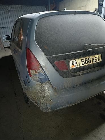 боковой ряд: Suzuki Liana: 2002 г., Механика, Бензин, Универсал — 3