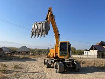 покрышка на погрузчик цена: Экскаватор, Колесный — 4
