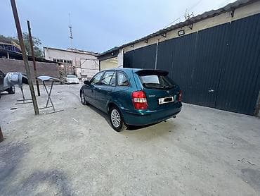 Mazda 323: 1999 г., 1.5 л, Автомат, Бензин, Хэтчбэк — 4