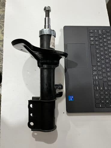 gd: Передний амортизатор Mazda 1992 г., Новый — 2