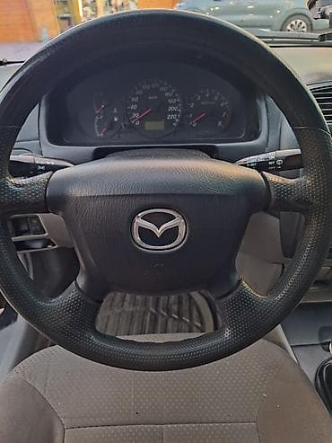 mazda 626 1998: Mazda 323: 2002 г., 1.3 л, Механика, Бензин, Универсал — 4