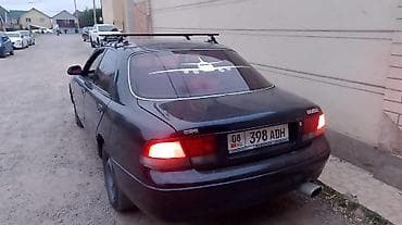 Унаа: Mazda 626: 1995 г., 1.8 л, Кол менен иштөөчү, Бензин, Седан — 2