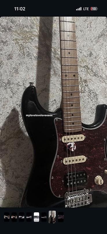 Электрогитара формата S‑style (тип Strat) в классическом черном цвете