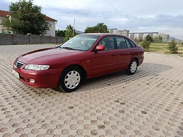down pipe: Mazda 626: 2000 г., 2 л, Механика, Бензин, Хэтчбэк — 1