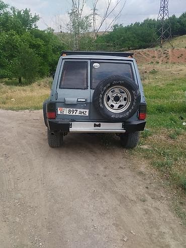 кел кел: Nissan : 1991 г., 3.2 л, Кол менен иштөөчү, Дизель, Жол тандабас — 2