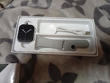 Смарт-часы в комплекте Описание: - Корпус прямоугольной формы с