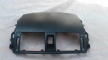 каракол жарнамасы: Верхняя панель торпеды Тойота Короллы Е150, 
Toyota Corolla В — 1