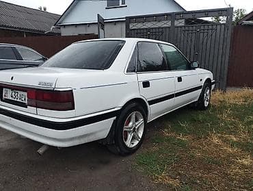 Транспорт: Mazda 626: 1989 г., 2 л, Механика, Газ, Седан — 4